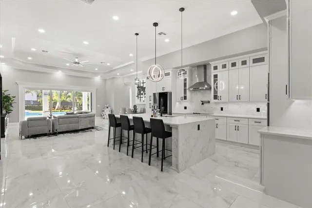 a large kitchen with a table and chairs
