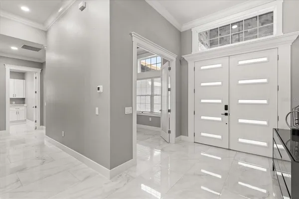 a spacious bathroom with a granite countertop sink and a mirror