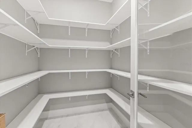 a kitchen with stainless steel appliances kitchen island granite countertop a sink and cabinets