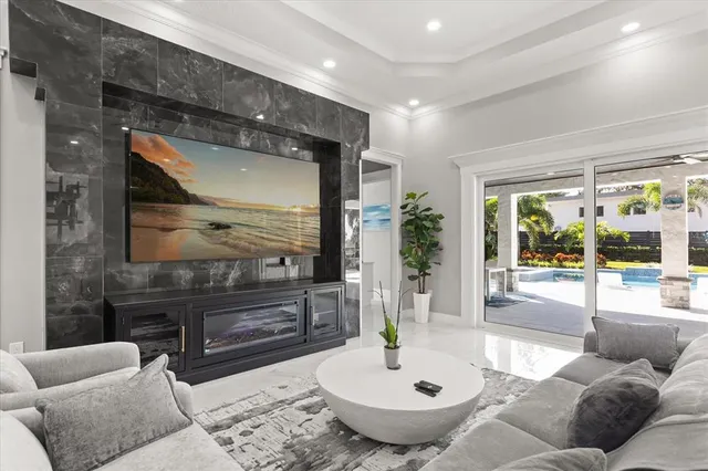 a living room with furniture and a flat screen tv
