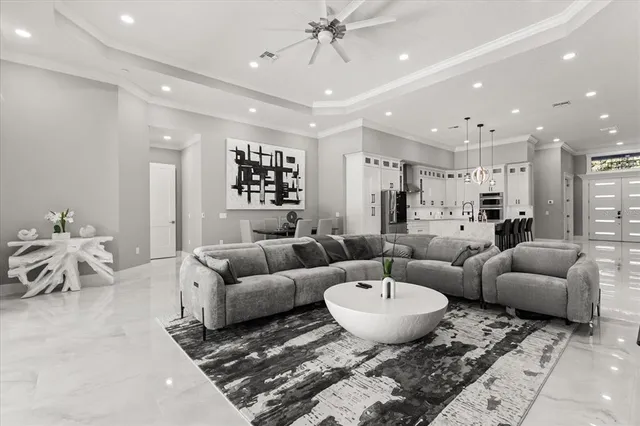 a living room with furniture a rug and white walls