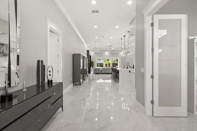 a view of a hallway with living room