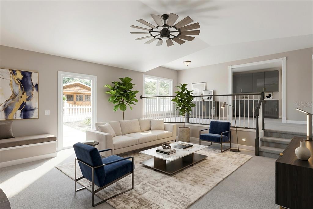 1048 North Grandview Street Mount Dora, FL 32757 - Photo 11 of 56 a living room with furniture and a large window