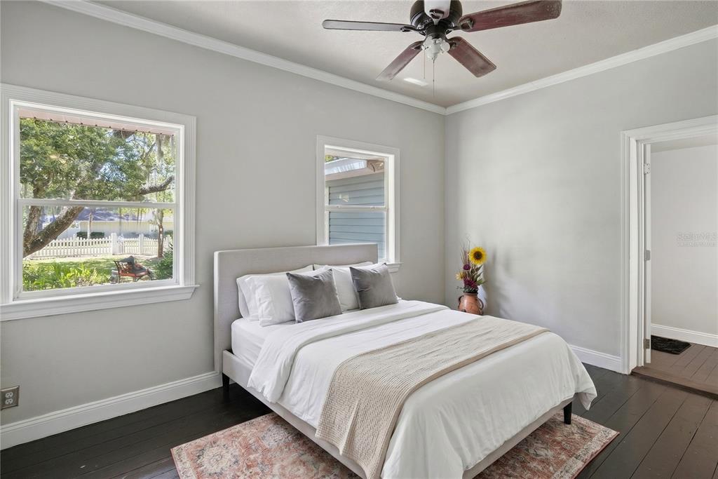 1048 North Grandview Street Mount Dora, FL 32757 - Photo 13 of 56 a bedroom with a bed and window