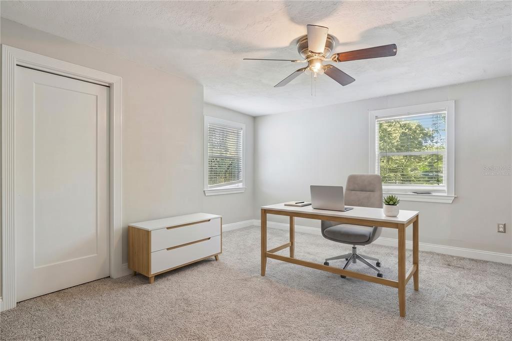 1048 North Grandview Street Mount Dora, FL 32757 - Photo 15 of 56 a workspace with a window and a ceiling fan