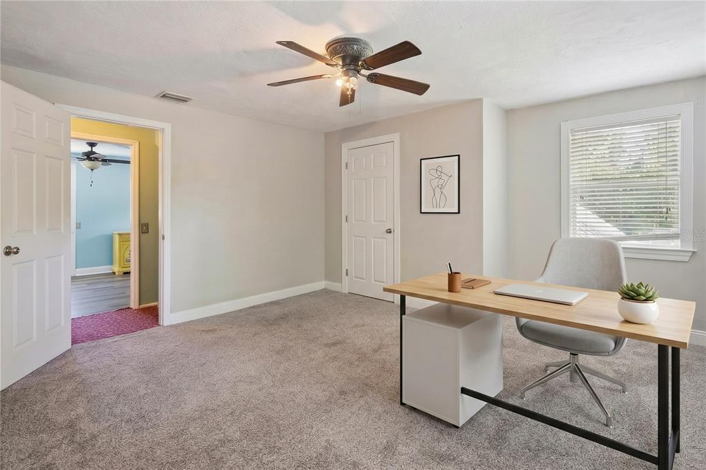 1048 North Grandview Street Mount Dora, FL 32757 - Photo 16 of 56 a workspace with furniture and window