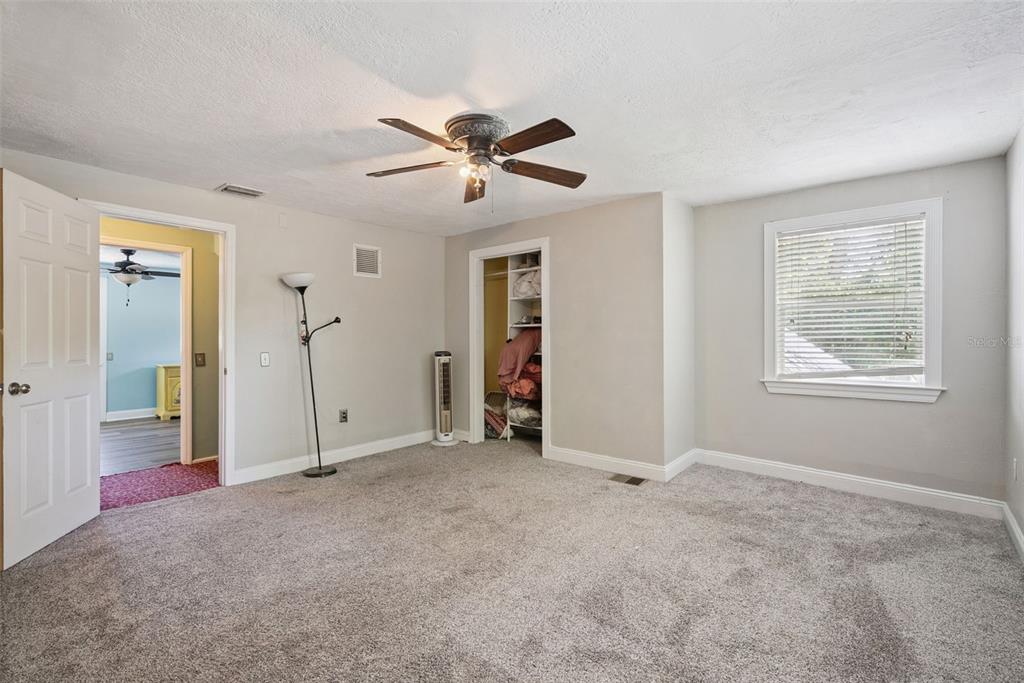 1048 North Grandview Street Mount Dora, FL 32757 - Photo 17 of 56 a view of empty room with window and ceiling fan
