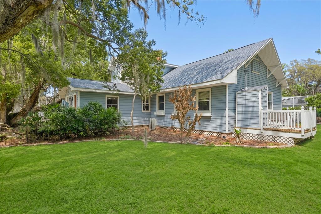 1048 North Grandview Street Mount Dora, FL 32757 - Photo 2 of 56 a front view of a house with a yard and green space