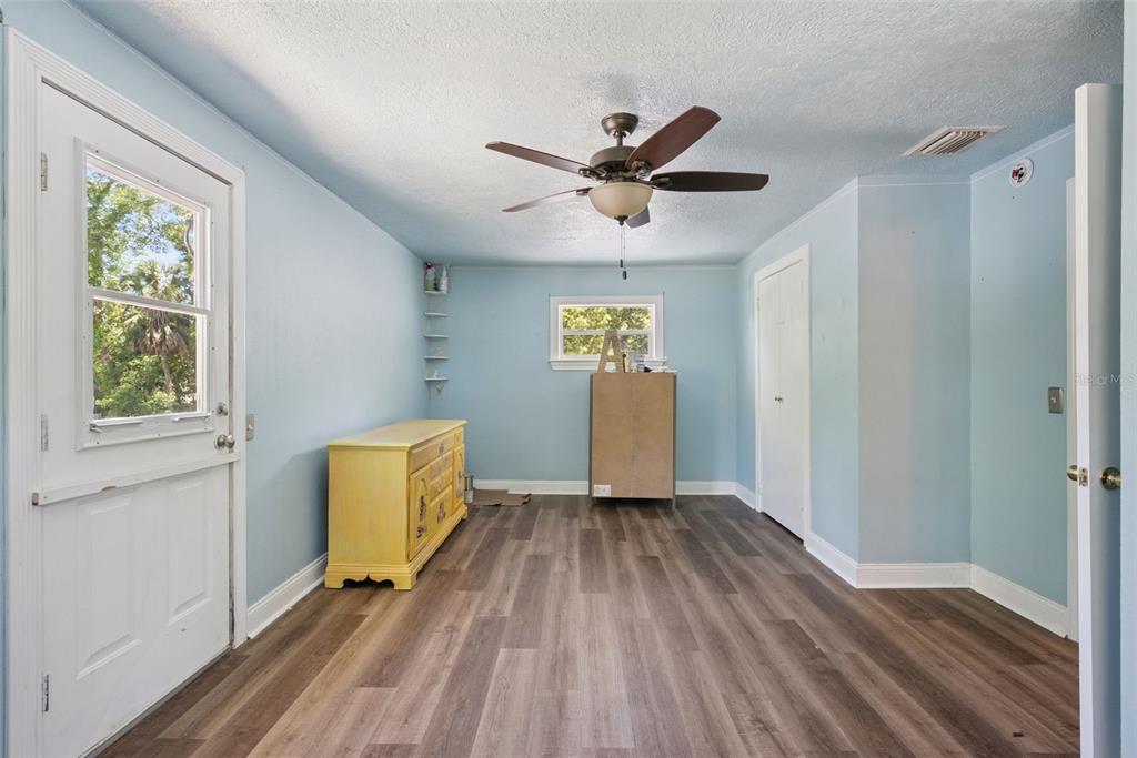 1048 North Grandview Street Mount Dora, FL 32757 - Photo 21 of 56 a view of empty room with wooden floor and fan