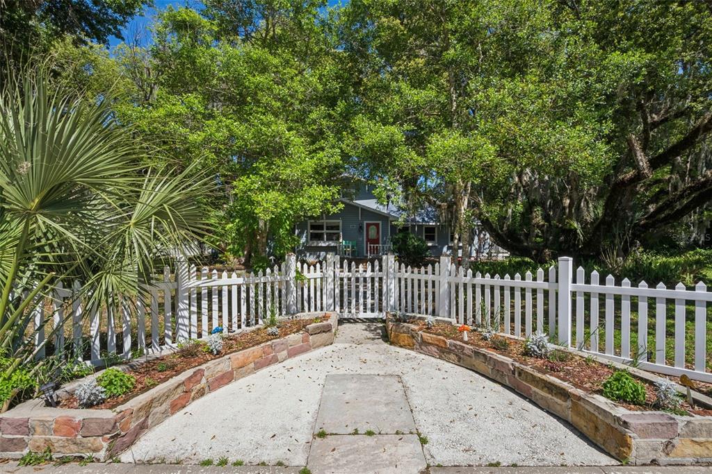 1048 North Grandview Street Mount Dora, FL 32757 - Photo 32 of 56 a view of a park with a large trees