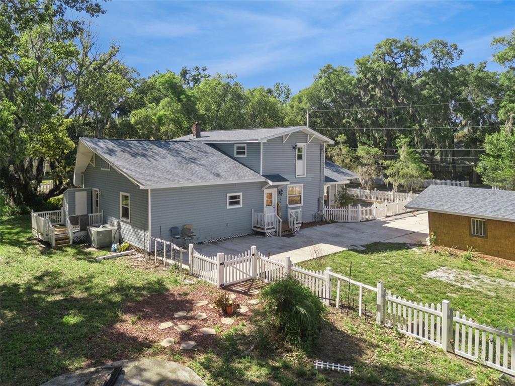 1048 North Grandview Street Mount Dora, FL 32757 - Photo 36 of 56 a view of a house with yard and sitting area