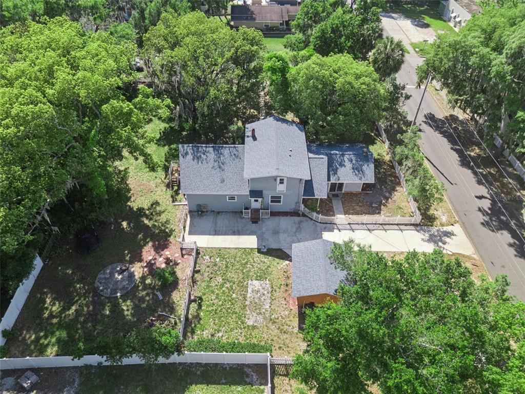 1048 North Grandview Street Mount Dora, FL 32757 - Photo 43 of 56 an aerial view of a house with a yard basket ball court and outdoor seating