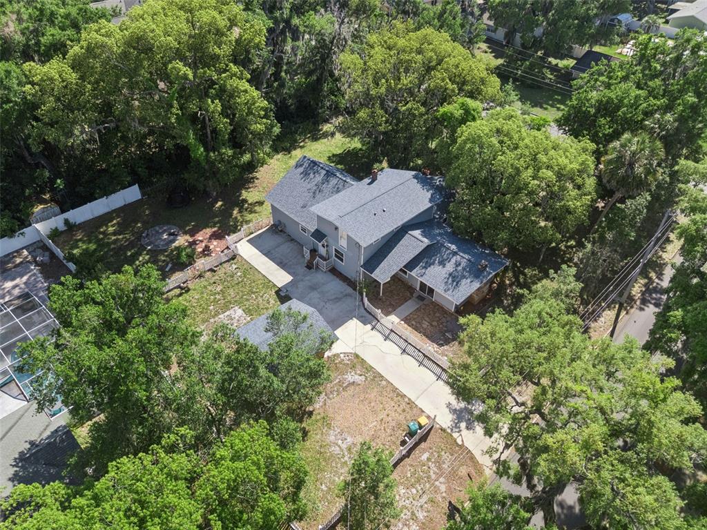 1048 North Grandview Street Mount Dora, FL 32757 - Photo 46 of 56 an aerial view of a house with outdoor space and street view