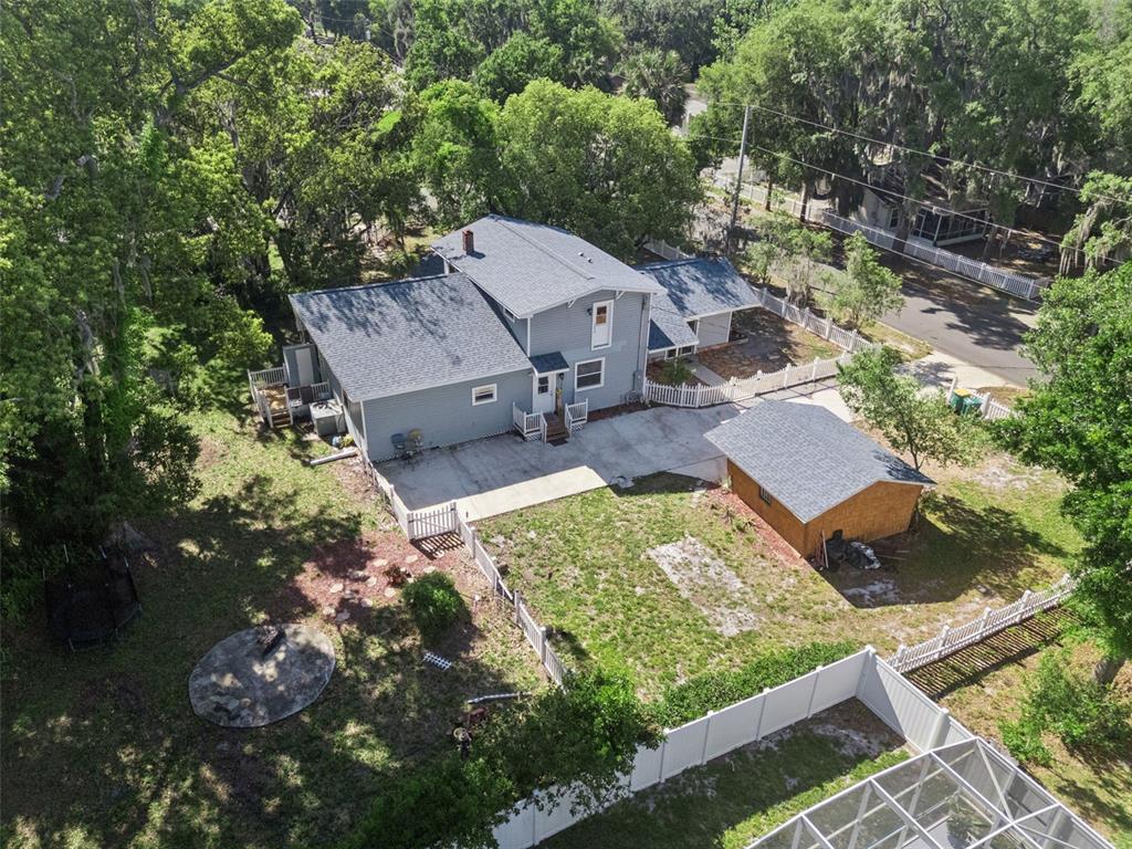 1048 North Grandview Street Mount Dora, FL 32757 - Photo 49 of 56 an aerial view of a house with a yard basket ball court and outdoor seating
