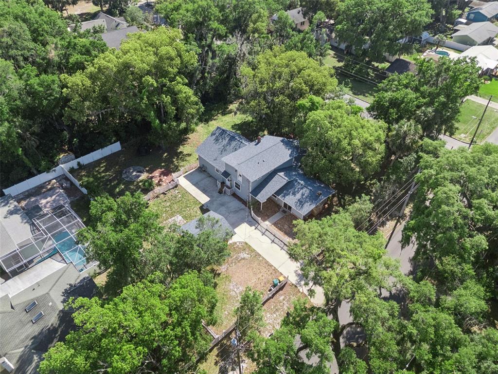 1048 North Grandview Street Mount Dora, FL 32757 - Photo 50 of 56 an aerial view of a house with a yard