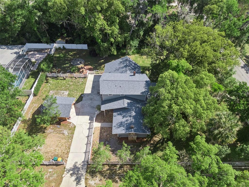 1048 North Grandview Street Mount Dora, FL 32757 - Photo 54 of 56 an aerial view of a house with a garden