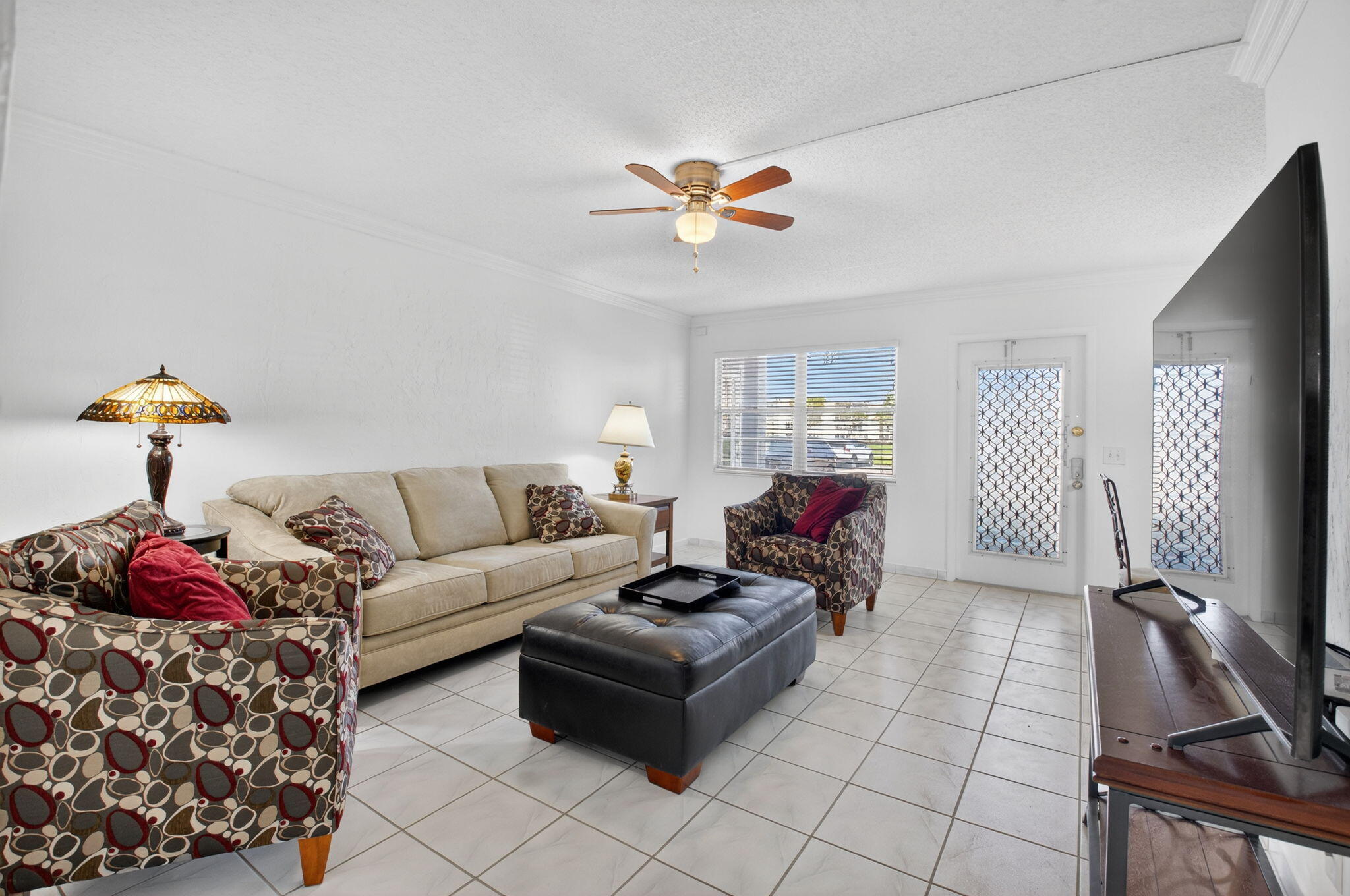 1056 Guildford East, Unit 1056 Boca Raton, FL 33434 - Photo 5 of 57 a living room with furniture
