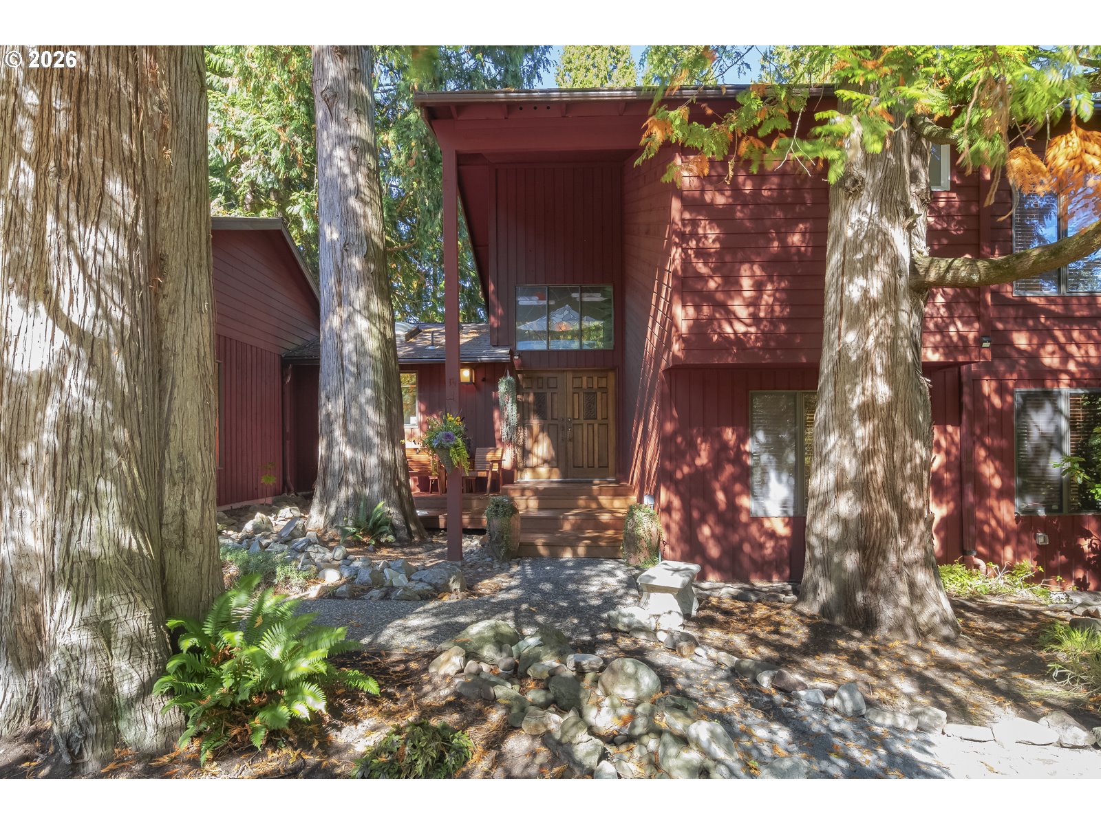a view of a house with a tree