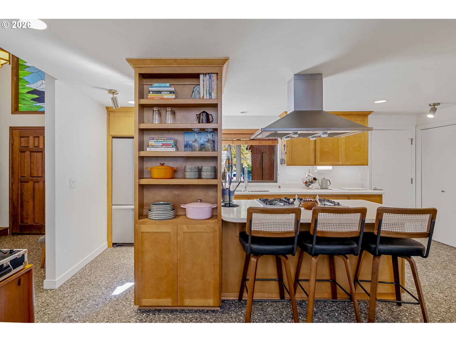 875 Southeast 25th Street Gresham, OR 97080 - Photo 13 of 48 a dining room with stainless steel appliances kitchen island a table and chairs