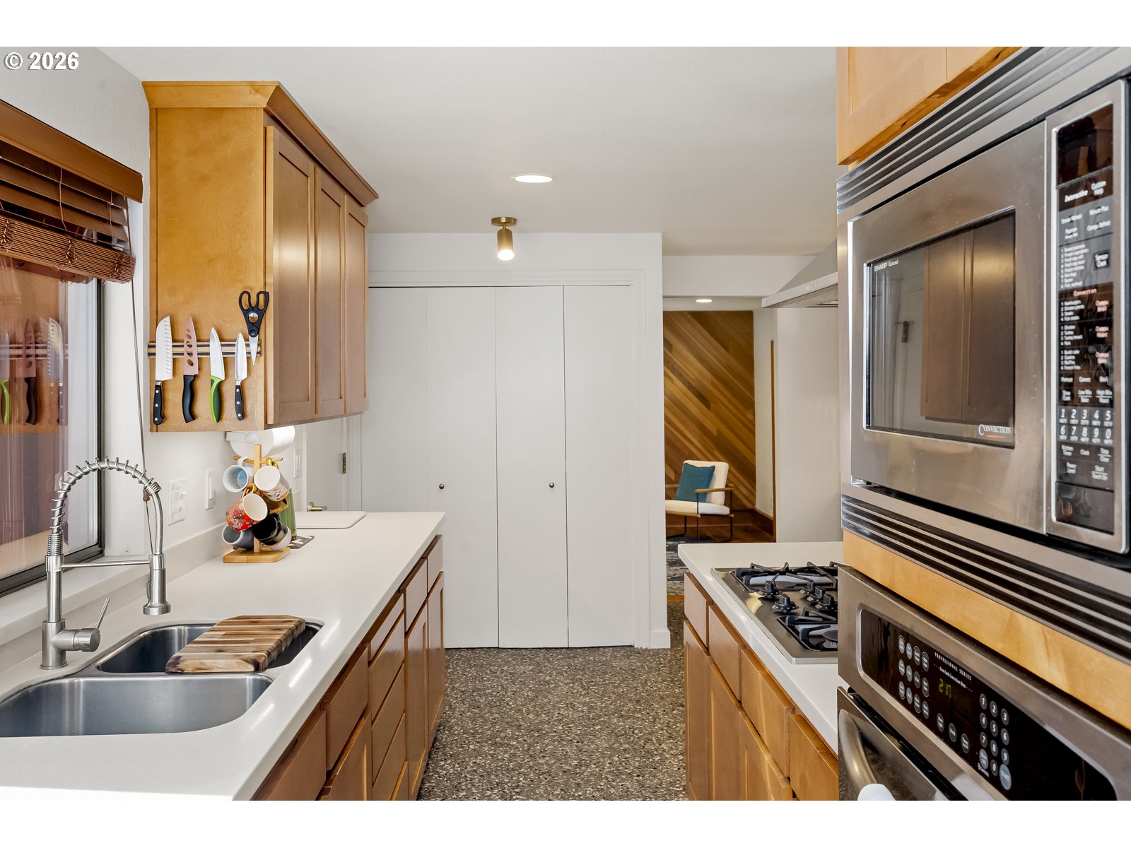 875 Southeast 25th Street Gresham, OR 97080 - Photo 14 of 48 a kitchen with kitchen island a sink stove and refrigerator
