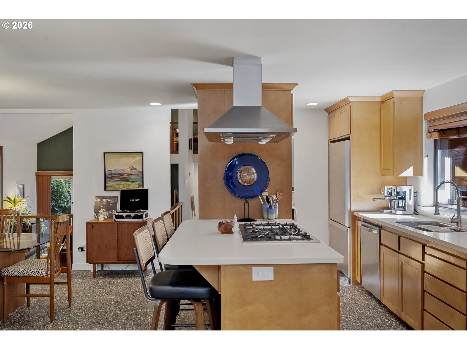 875 Southeast 25th Street Gresham, OR 97080 - Photo 19 of 48 a kitchen with stainless steel appliances kitchen island granite countertop a stove a sink and a dining table