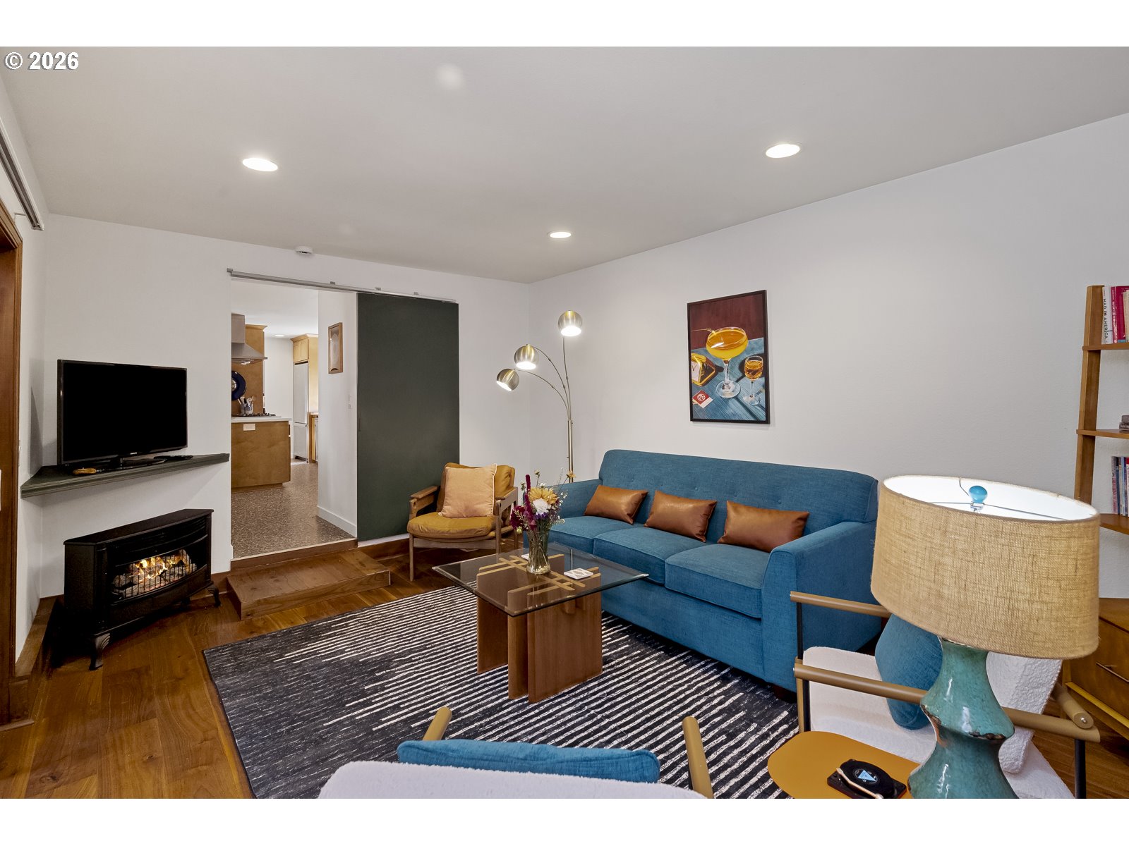 875 Southeast 25th Street Gresham, OR 97080 - Photo 23 of 48 a living room with furniture and a flat screen tv
