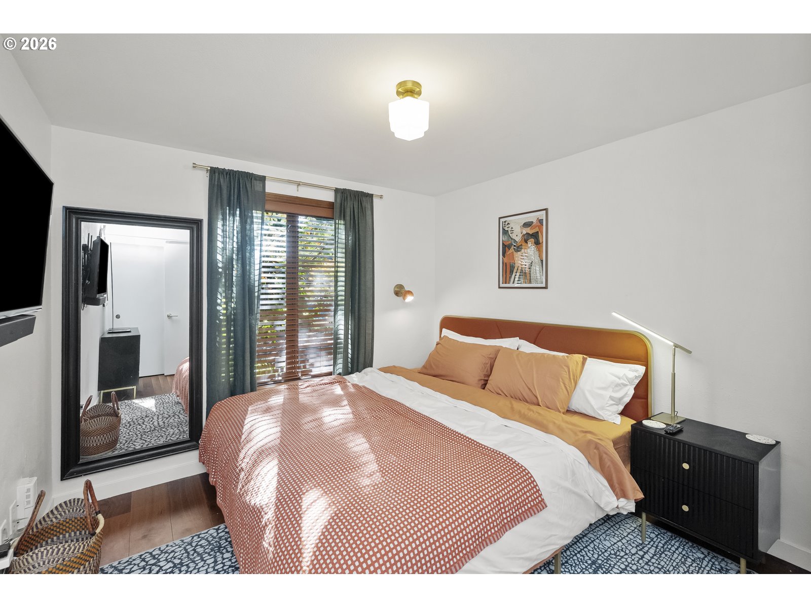 875 Southeast 25th Street Gresham, OR 97080 - Photo 24 of 48 a bedroom with a bed and a large mirror