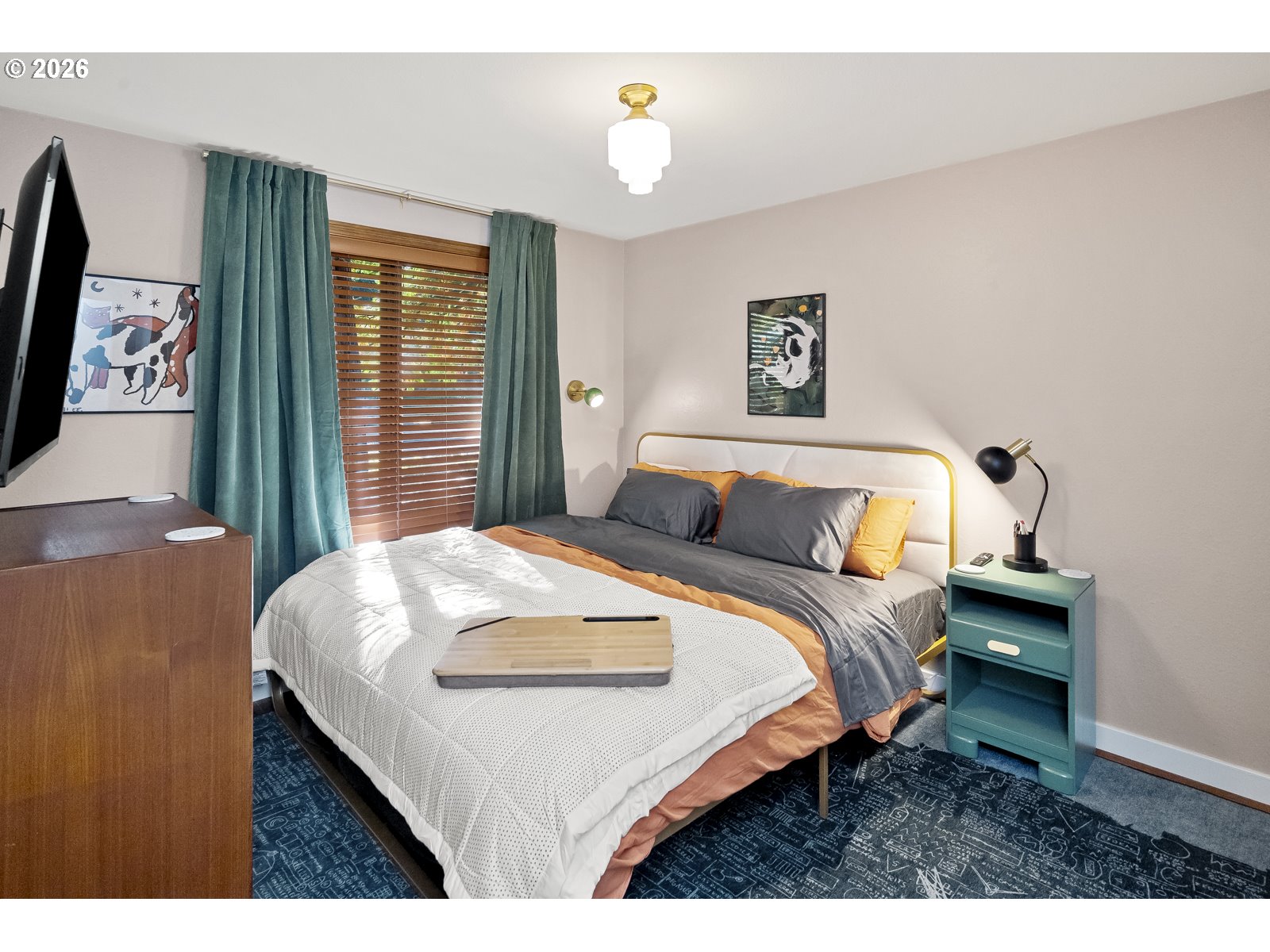 875 Southeast 25th Street Gresham, OR 97080 - Photo 26 of 48 a bedroom with a bed and a flat tv screen on dresser