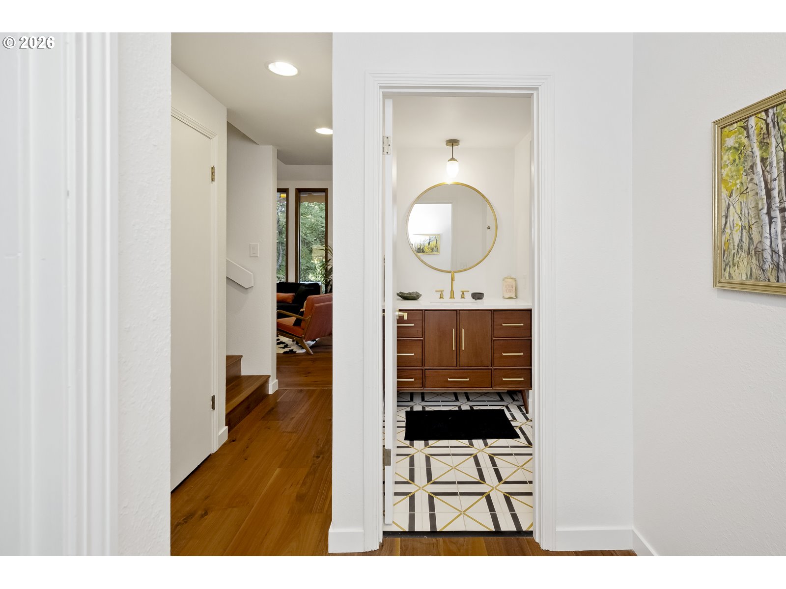 875 Southeast 25th Street Gresham, OR 97080 - Photo 27 of 48 a view of a hallway with wooden floor windows and a bathroom
