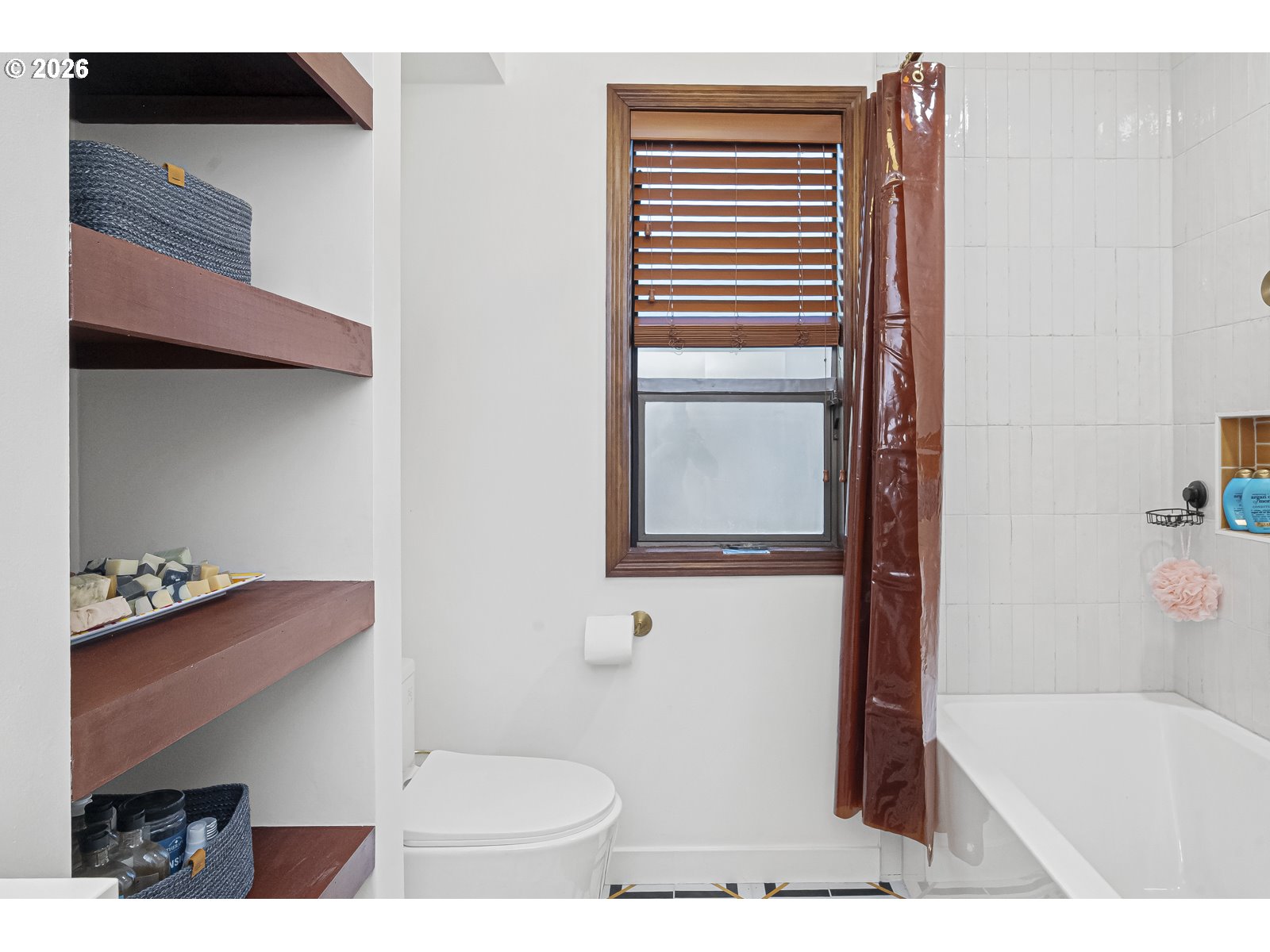 875 Southeast 25th Street Gresham, OR 97080 - Photo 29 of 48 a bathroom with a toilet and a bathtub