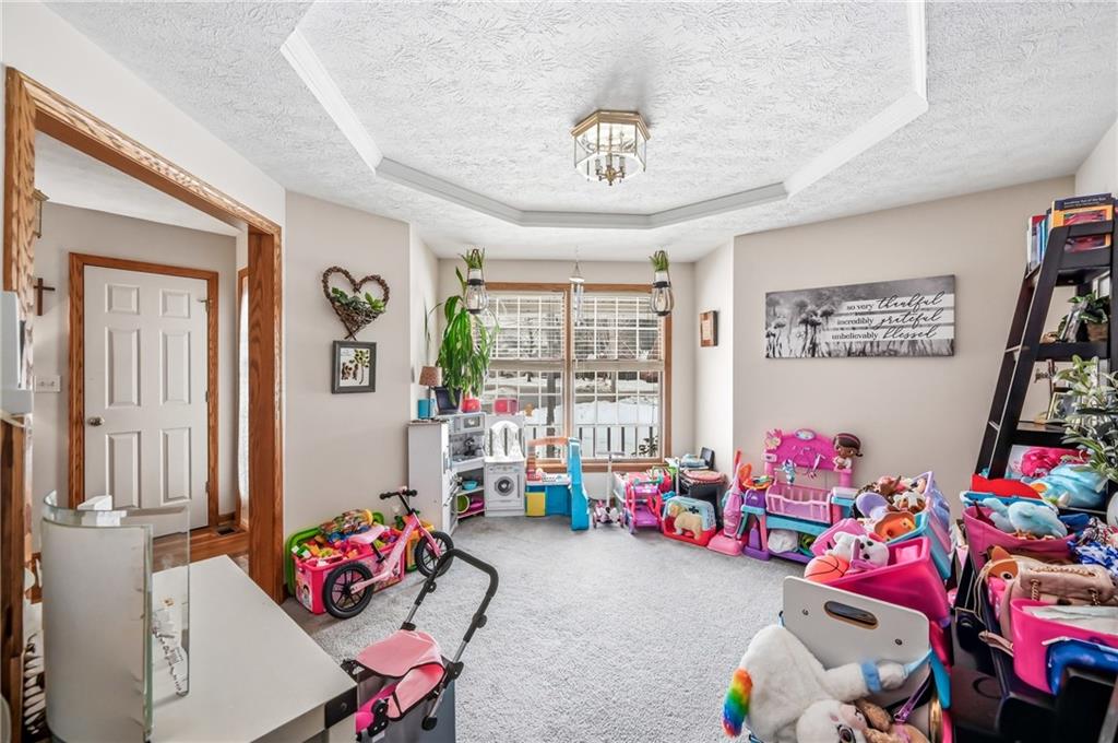 1359 Highland Road Sharon, PA 16146 - Photo 12 of 32 a kids room with toys and a chandelier