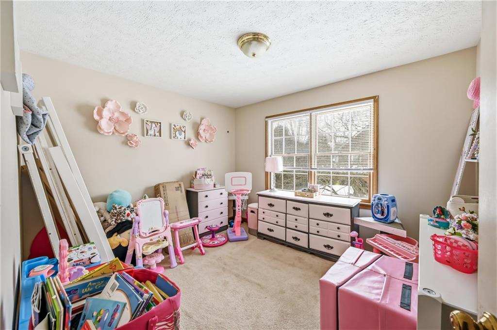 1359 Highland Road Sharon, PA 16146 - Photo 19 of 32 a living room with furniture and a window