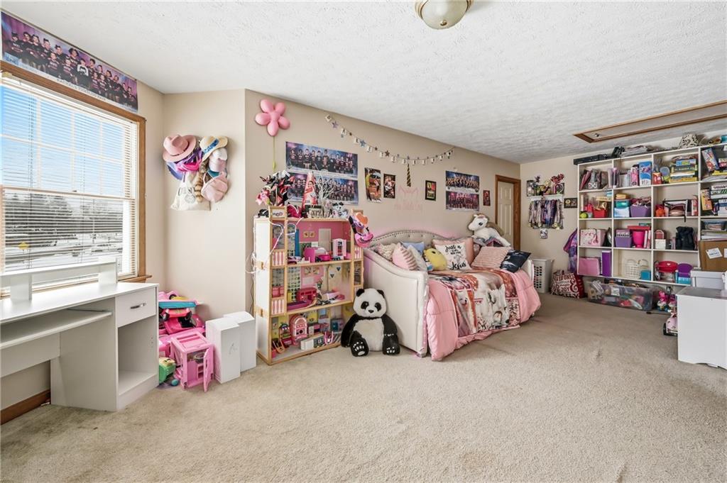 1359 Highland Road Sharon, PA 16146 - Photo 20 of 32 a bedroom with baby bed toys and a large window