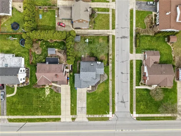 front view of a house with a garden