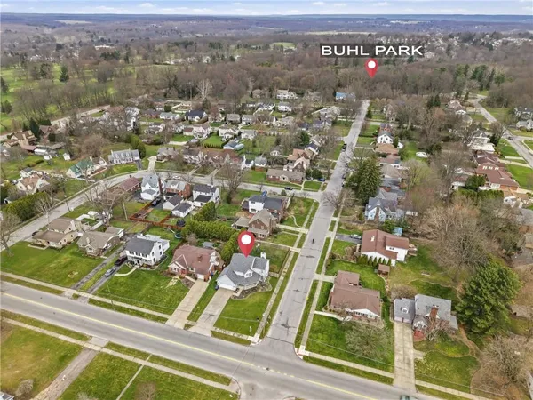 an aerial view of residential houses with outdoor space