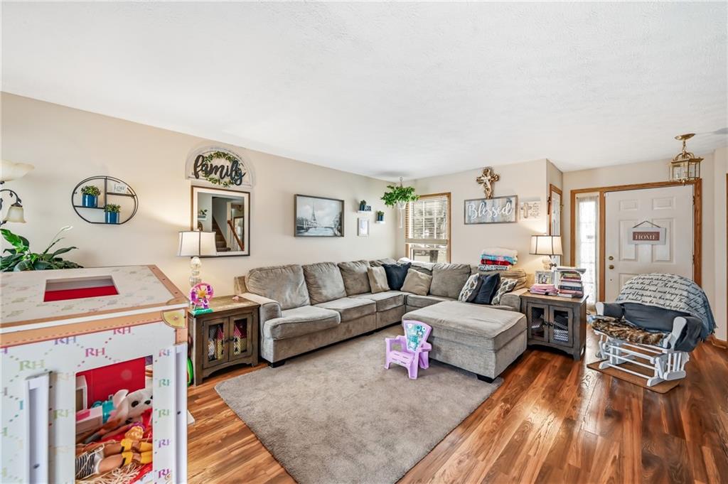 1359 Highland Road Sharon, PA 16146 - Photo 4 of 32 a living room with furniture and a couch
