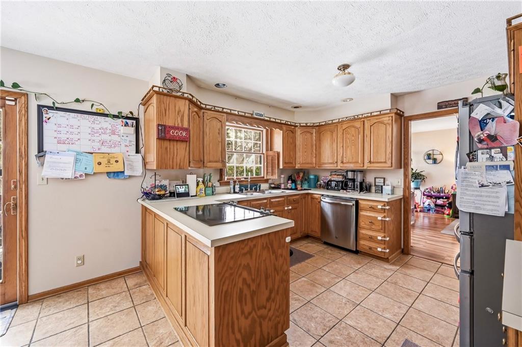 1359 Highland Road Sharon, PA 16146 - Photo 6 of 32 a kitchen with a sink stove and cabinets