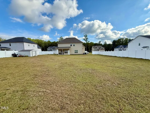 a view of a large body of water with a building in the background