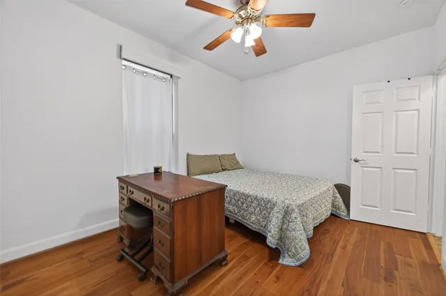 a room with a bed and a chandelier