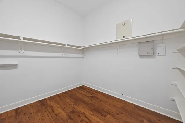 a view of a room with wooden floor