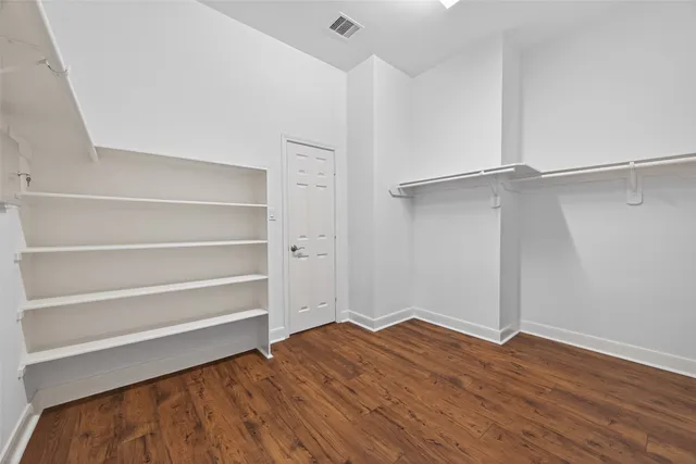 a view of an empty room with empty racks