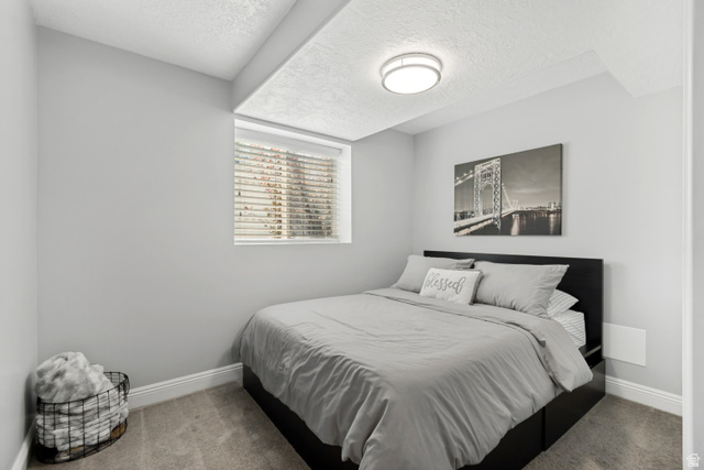 4752 South 4075th Street West Roy, UT 84067 - Photo 20 of 28 Carpeted room featuring a window with blinds, recessed ceiling, and a flush mount light fixture