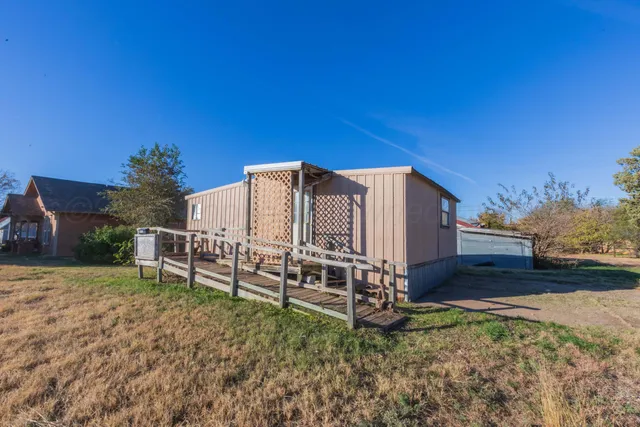 a view of entryway with wooden walls