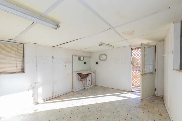 a view of kitchen with furniture and window