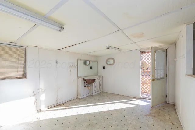a view of kitchen with furniture and window