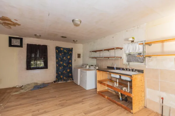 a kitchen with a stove and a refrigerator