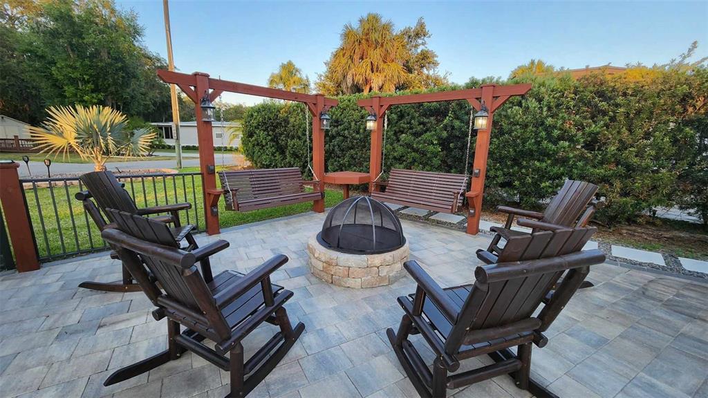 a view of a patio with iron fence