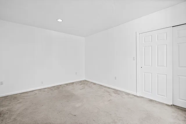 an empty room with white walls
