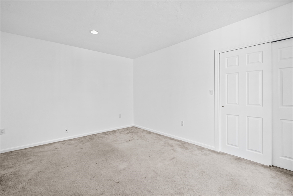 93 West R W Emerson, Unit 93R Melrose, MA 02176 - Photo 11 of 21 an empty room with white walls