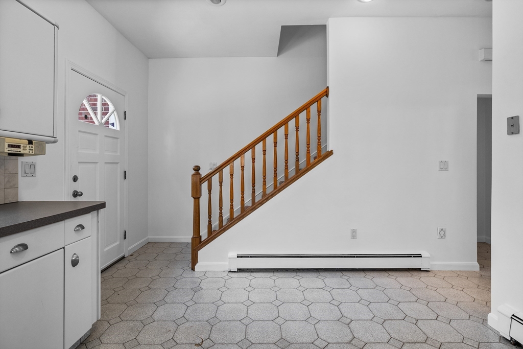 93 West R W Emerson, Unit 93R Melrose, MA 02176 - Photo 12 of 21 a view of a hallway with entryway